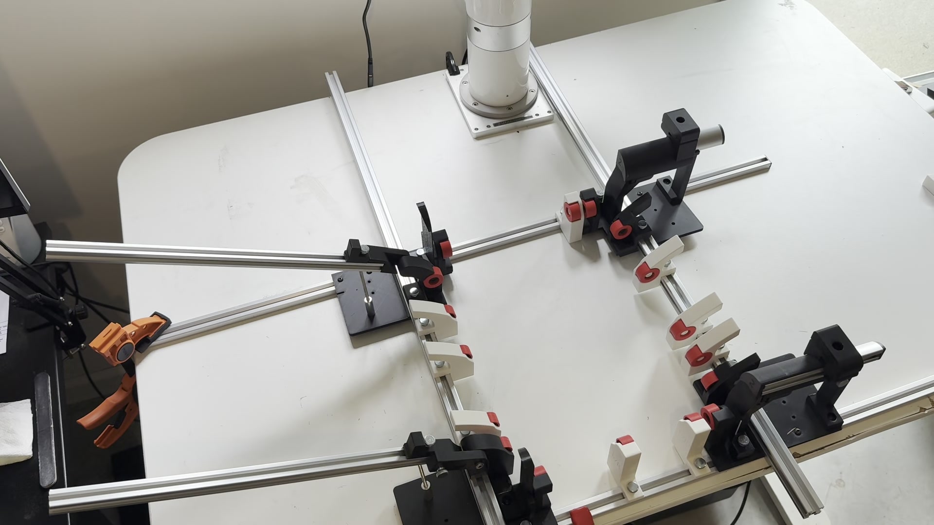 Actual fixture with adjustable aluminum rails and folding guides